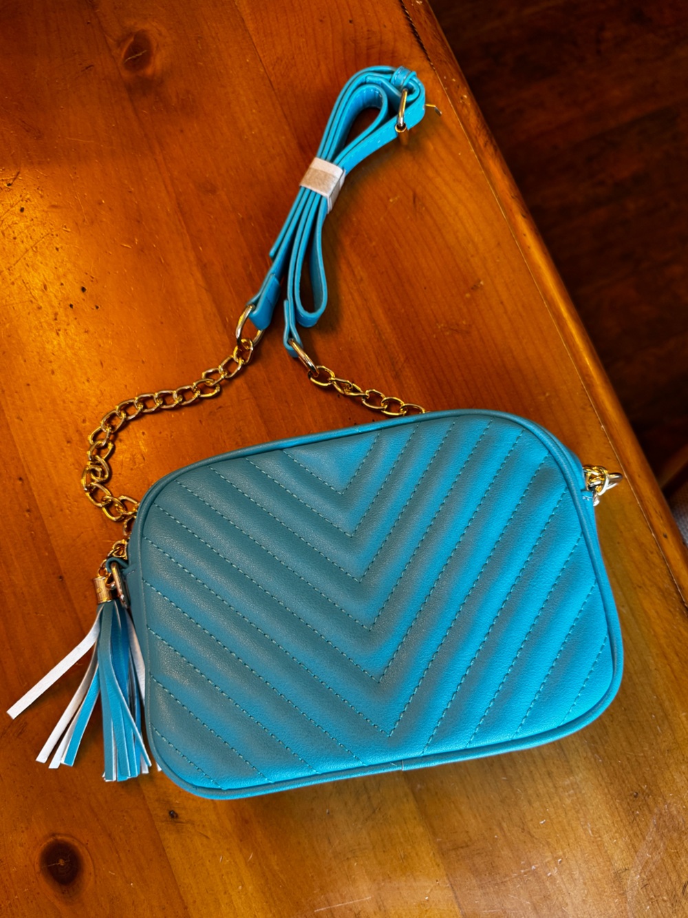 Blue Quilted Crossbody Bag with Adjustable Gold Chain Strap